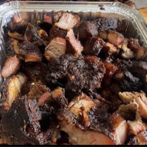 Jamaican oven style Jerk pork served with your choice of rice dish -  serves two