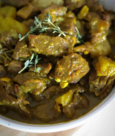 Jamaican curried Goat served with your choice of rice dish –  serves two