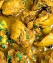Jamaican  curry  chicken served with your choice of rice dish –  serves two
