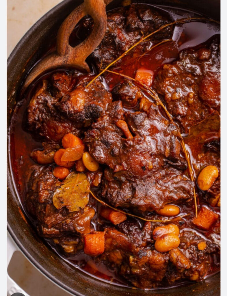 Jamaican  stew Oxtail with your choice of rice dish –  serves two