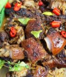 Jamaican oven style Jerk pork served with your choice of rice dish –  serves two