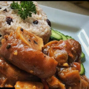 Jamaican brown stew cow foot and beans served with your choice of rice dish -  serves two