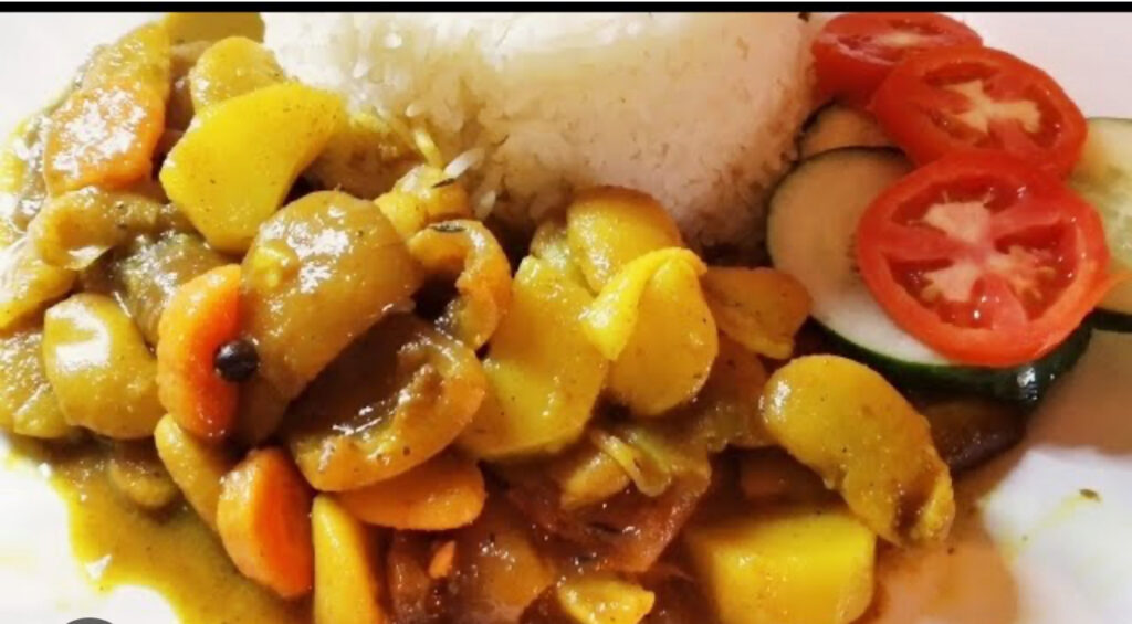 Jamaican  cow tripe “Shaki’  and beans served with  a choice of rice dishes , serves two