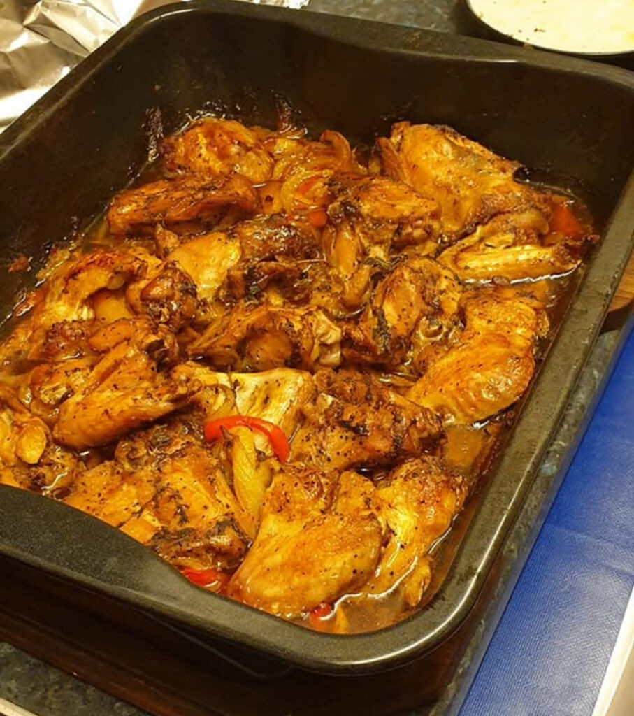 Jamaican oven roast chicken Pieces served  with a choice of Rice dishes – serves two