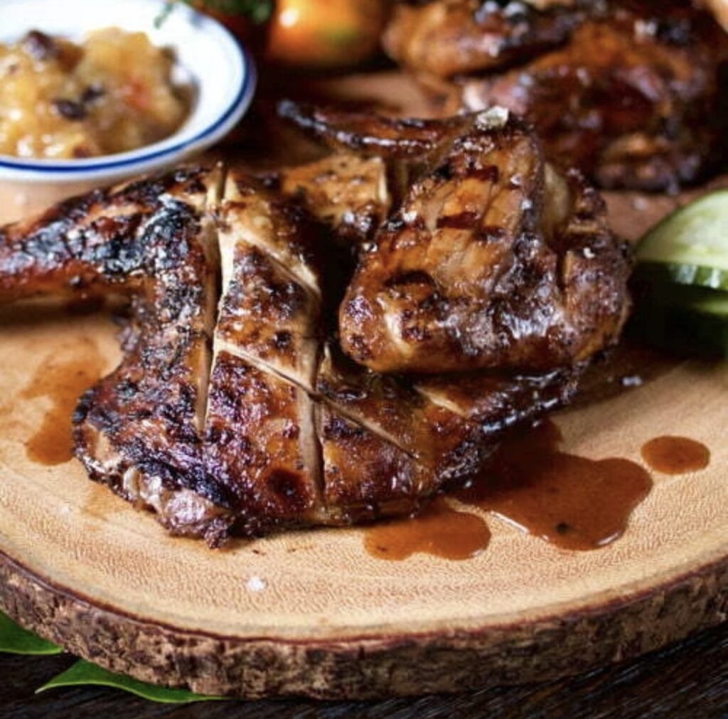 Jamaican oven style  BBQ Jerk chicken  served with a choice of Rice dish –  serves two