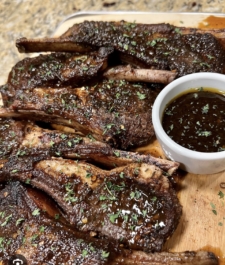 Jamaican  Jerk lamb  hops served with your choice of rice dish – Serves two