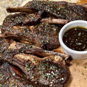 Jamaican  Jerk lamb  hops served with your choice of rice dish - Serves two